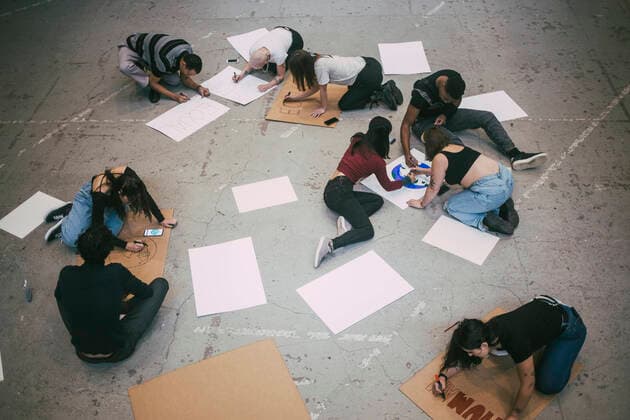 Male and female protestors preparing signboards in building Sweden, Stockholm, model released, property released Copyright: xMaskotx , MA84508