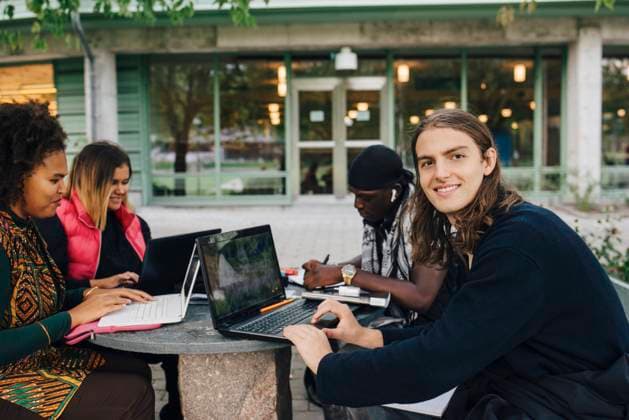 Smiling university student studying in college Sweden, Stockholm, model released Copyright: xMaskotx , MA84751