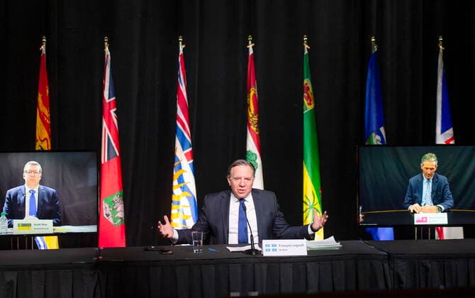 March 4, 2021, Montreal, PQ, Canada: Quebec Premier Francois Legault chairs a premiers virtual news conference as Premier Scott Moe, left, Saskatchewan, and Brian Pallister, Manitoba, are seen on screen, Thursday, March 4, 2021 in Montreal. Montreal Canada - ZUMAc35_ 20210304_zaf_c35_036 Copyright: xRyanxRemiorzx