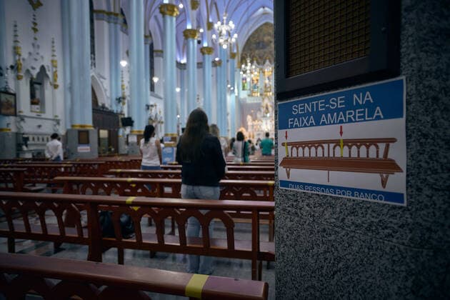 March 4, 2021, Franca, Sao Paulo, Brazil: Poster asks faithful to respect the capacity of 2 people per seat while attending Mass at the Cathedral of Our Lady of the Immaculate Conception, in Franca, Sao Paulo, Brazil on 4 March 2021. The governor of Sao Paulo, Joao Doria, announced a red flag starting at 12:00 am next Saturday, 6 March 2021, for the entire state, signaling that only essential services will be allowed to operate, framing religious celebrations as essential. The measure aims to curb the rate of contamination by coronavirus, which transmits covid-19, after the number of hospitalizations and deaths has hit consecutive records. Franca Brazil - ZUMAv129 20210304_znp_v129_005 Copyright: xIgorxDoxValex