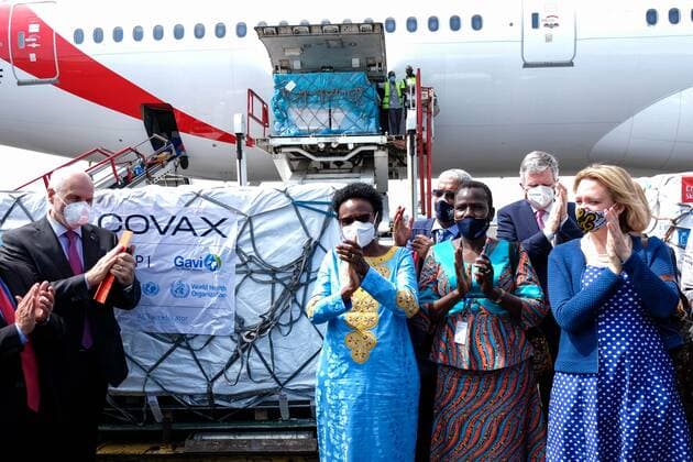(210306) -- ENTEBBE, March 6, 2021 -- Jane Ruth Aceng (3rd R, Front), Uganda s Minister of Health, and other officials applaud after receiving AstraZeneca-Oxford vaccines from COVAX vaccine sharing program at Entebbe International Airport, Uganda, March 5, 2021. Uganda on Friday received the first batch of COVID-19 vaccines from COVAX facility. (Photo by Xinhua) UGANDA-ENTEBBE-COVAX-COVID-19 VACCINES-ARRIVAL HajarahxNalwadda 