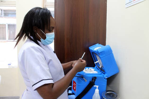 (210306) -- NAIROBI, March 6, 2021 -- A nurse prepares to administer a shot of AstraZeneca COVID-19 vaccine at Kenyatta National Hospital in Nairobi, Kenya, March 5, 2021. Kenya s health ministry on Friday kicked off COVID-19 vaccination campaign with frontline health workers as the first to receive the vaccine. (Photo by Xinhua) KENYA-NAIROBI-COVID-19-VACCINATION JoyxNabukewa 