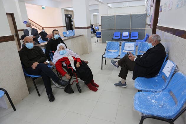 March 6, 2021, Bureij, Gaza Strip, Palestinian Territory: Palestinians wait as they receive the dose of a COVID-19 vaccine at a UN clinic in Al-Bureij camp in the central Gaza Strip, on March 6, 2021 Bureij Palestinian Territory - ZUMAap3_ 20210306_zaf_ap3_127 Copyright: xAshrafxAmrax