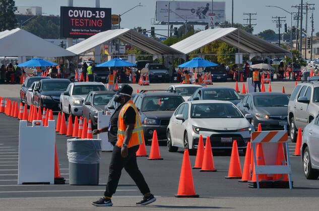 Drivers remain in their vehicles while being monitored to ensure they suffer no adverse reaction to the COVID-19 Moderna vaccine they received at the Forum in Inglewood, California on Saturday, March 6, 2021. As more Californians get vaccinated, the state will make it easier for counties to reopen, Newsom administration officials announced this week. Once 2 million coronavirus vaccines have been given to people in the state s most disadvantaged ZIP codes, the California Department of Public Health will lower the threshold for counties to move from the most restrictive purple tier into the less restrictive red tier.  LAP2021030601 JIMxRUYMEN