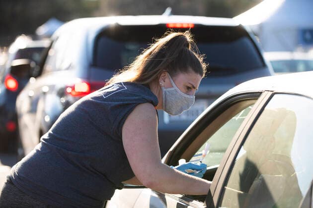 March 7, 2021, Round Rock, Texas, USA: Round Rock, TX USA March 6, 2021: Emergency tech Tabitha Kozster vaccinates a patient as Williamson County hosts a 24-hour vaccine marathon to catch up with COVID-19 vaccination schedule after last month s devastating winter storm that crippled much of Texas. The goal was to vaccinate up to 7,000 Texans with first or second Moderna doses. Round Rock USA - ZUMAd150 20210307_znp_d150_007 Copyright: xBobxDaemmrichx