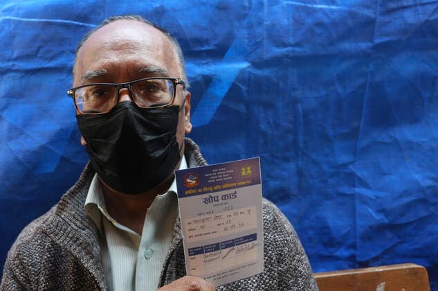 March 8, 2021, Kathmandu, Bagmati, Nepal: An elderly person shows his vaccine card after receiving a dose of Covishield COVID-19 vaccine at a hospital in Kathmandu,Nepal on March 8, 2021. Nepal started the nationwide campaign to inoculate the elderly population,over 65 years with with Covishield,the Oxford-AstraZeneca vaccine. Kathmandu Nepal - ZUMAs233 20210308_zap_s233_003 Copyright: xSunilxSharmax