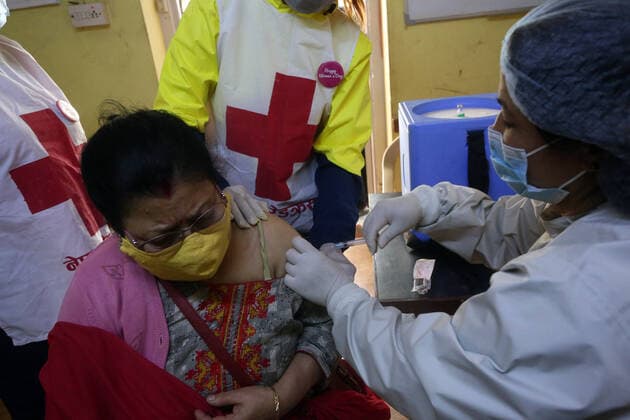 March 8, 2021, Kathmandu, Bagmati, Nepal: A female health worker gives a dose of Covishield COVID-19 vaccine to an elderly woman on International Women s Day at a hospital in Kathmandu,Nepal on March 8, 2021. Kathmandu Nepal - ZUMAs233 20210308_zap_s233_008 Copyright: xSunilxSharmax