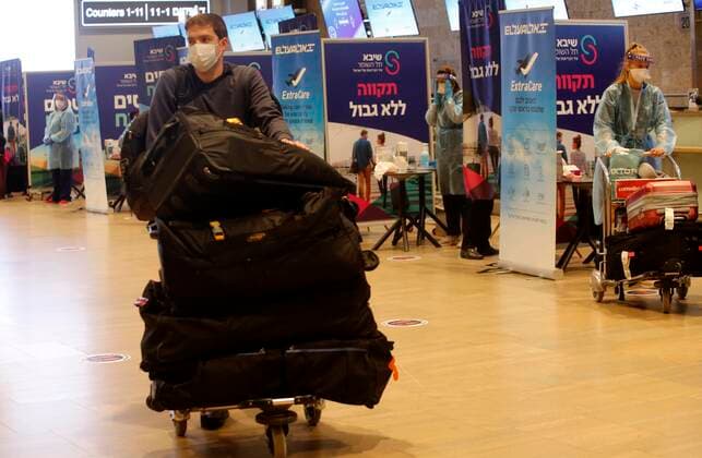 (210309) -- TEL AVIV, March 9, 2021 -- A traveler arrives at Ben Gurion International Airport near Tel Aviv, Israel, on March 8, 2021. Israel on Monday lifted the ban on entry of foreign nationals into the country, according to a statement issued by Israel s Population and Immigration Authority. (Photo by Xinhua) ISRAEL-AIRPORT-COVID-19-CONTROL MEASURES GilxCohenxMagen 