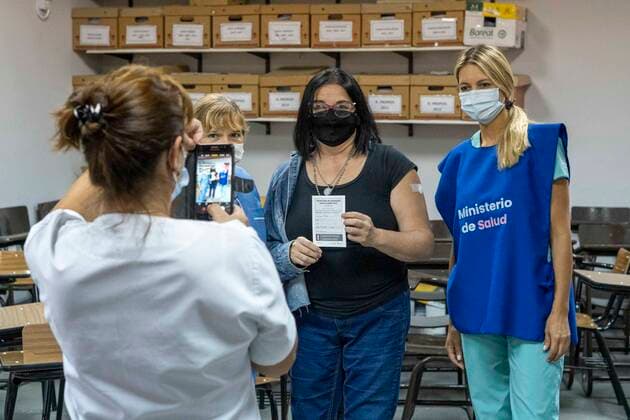 March 9, 2021, Firmat, Santa Fe, Argentina: After receiving a shot of the Sinopharm vaccine against COVID-19 inside San Martin Hospita, a teacher gets a picture with the vaccination team. As the global immunization campaign carries-on, Argentina has now specifically targeted education workers ahead of the return to school. Firmat Argentina - ZUMAm105 20210309_zaf_m105_014 Copyright: xPatricioxMurphyx