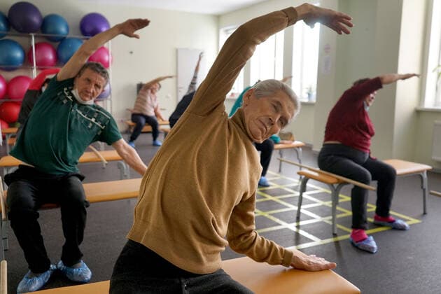 CHEBOKSARY, RUSSIA â€“ MARCH 9, 2021: Patients do exercises during a physiotherapeutic physical training session in the Chuvashiyakurort sanatorium. The sanatorium delivers rehabilitation and care to patients after COVID-19. Chuvashiakurort offers hydrotherapy and mud bath therapy in combination with traditional sanatorium services and state-of-the-art medical technology. The unique feature of the sanatorium is therapeutic sapropelic mud from Kogoyar Lake, which is situated near the Volga River. Semyon Antonov TASS  TS0F8F14