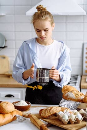 girl makes bread dough in a kitchen Paris, IDF, France CR_KUAL210309A-675686-01 EDITORIAL USE ONLY