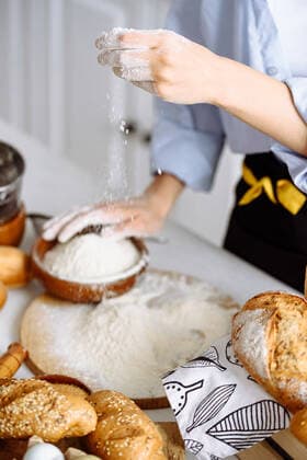 girl makes bread dough in a kitchen Paris, IDF, France CR_KUAL210309A-675695-01 EDITORIAL USE ONLY