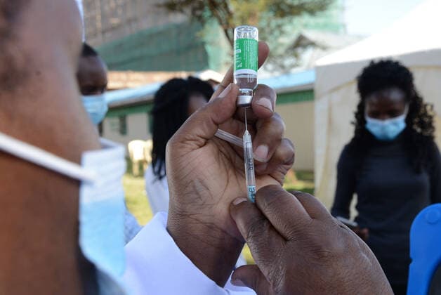March 9, 2021, Nairobi, Kenya: A healthcare worker prepares to administer an Oxford AstraZeneca COVID-19 vaccine to a colleague at Mutuini Hospital in Nairobi. .Kenya on March 3, 2021 received its first batch of 1.02 million doses of Oxford AstraZeneca through global COVAX scheme as part of the 24 million doses the country is expected to import in a couple of months. The vaccine which is currently being distributed to various stations across the country will first be administered to healthcare workers, teachers and people whose immunity is compromised. Nairobi Kenya - ZUMAs197 20210309_zaa_s197_046 Copyright: xDennisxSigwex