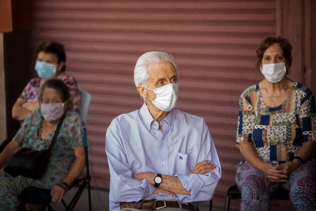 March 9, 2021, Buenos Aires, Argentina: Elderly citizens wait in their seats to receive the Covid19 Vaccination at Luna Park Stadium..Due to the overwhelming numbers and the limited space at the Luna Park stadium, many senior citizens had to wait, sitting in the sun while others had to receive the Covid19 vaccination from specified cars. Buenos Aires Argentina - ZUMAs197 20210309_zaa_s197_130 Copyright: xAlejoxManuelxAvilax