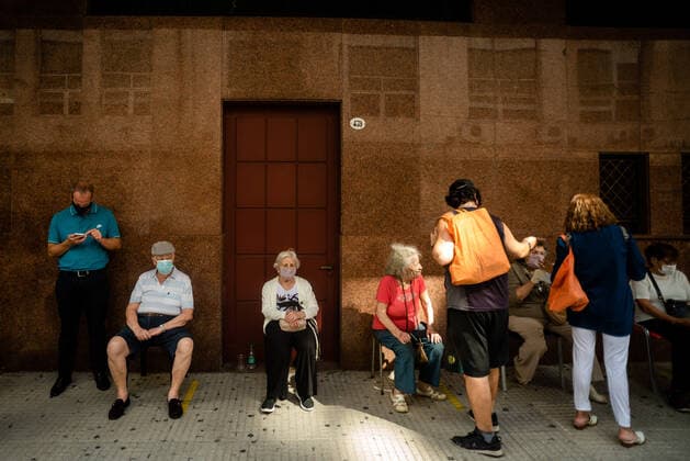 March 9, 2021, Buenos Aires, Argentina: Elderly citizens wait in their seats to receive the Covid19 Vaccination at Luna Park Stadium..Due to the overwhelming numbers and the limited space at the Luna Park stadium, many senior citizens had to wait, sitting in the sun while others had to receive the Covid19 vaccination from specified cars. Buenos Aires Argentina - ZUMAs197 20210309_zaa_s197_133 Copyright: xAlejoxManuelxAvilax