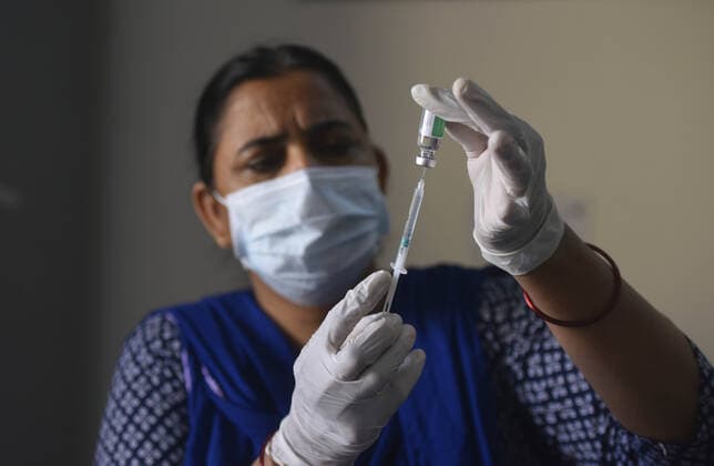 GURUGRAM, INDIA - MARCH 9: A health worker prepares a dose of Covid-19 vaccine, at Urban Primary Health Centre, at Wazriabad, on March 9, 2021 in Gurugram, India. (Photo by Vipin Kumar Hindustan Times )