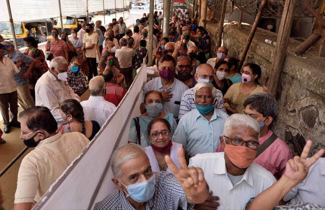 MUMBAI, INDIA - MARCH 9: Senior citizens lineup for the getting their first dose of Covid-19 vaccine, at Dahisar, on March 9, 2021 in Mumbai, India. (Photo by Satish Bate Hindustan Times )