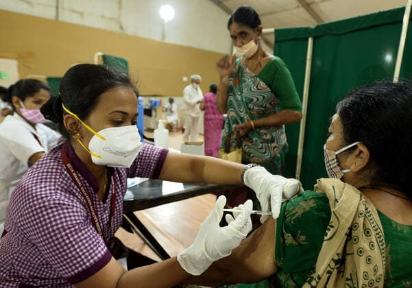 MUMBAI, INDIA - MARCH 9: An elderly woman gets vaccinated against Covid-19, at Dahisar, on March 9, 2021 in Mumbai, India. (Photo by Satish Bate Hindustan Times )