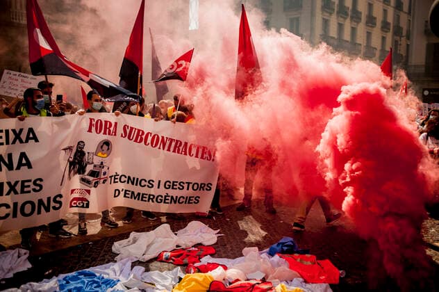 March 10, 2021, Barcelona, Spain: Healthcare workers protest amid smoke as they gather in Barcelona to demand an improvement in their working conditions aggravated by the coronavirus pandemic. Barcelona Spain - ZUMAb137 20210310_zap_b137_007 Copyright: xJordixBoixareux