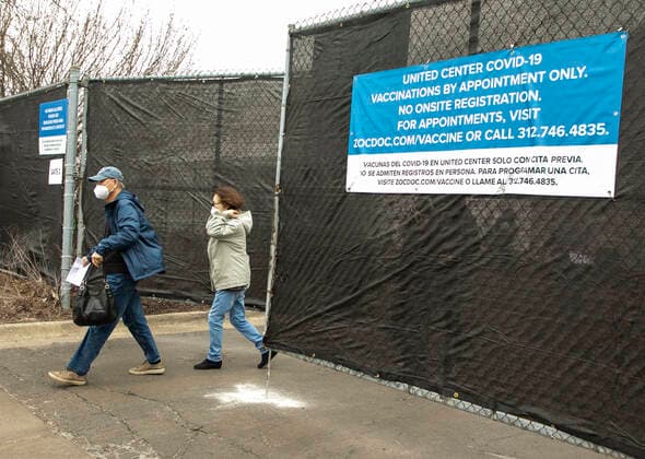 (210310) -- CHICAGO, March 10, 2021 -- People leave a mass COVID-19 vaccination site after getting vaccinated at the United Center in Chicago, the United States, on March 10, 2021. The mass COVID-19 vaccination site started running at the arena on Tuesday. (Photo by Xinhua) U.S.-CHICAGO-MASS VACCINATION SITE-OPENING JoelxLerner 