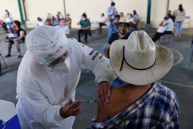 March 10, 2021, Uruapan, Michoacan, Mexico: A person receives a dose of Pfizer-BioNTech Covid-19 vaccine before inject to an elderly, during mass vaccine inside of Hermanos Lopez Rayon sports center, a designated priority vaccination center for elderly over 60 years in the Uruapan town. On March 10, 2021 in Michoacan, Mexico. Uruapan Mexico - ZUMAe321 20210310_zia_e321_009 Copyright: xCarlosxGuzmanx