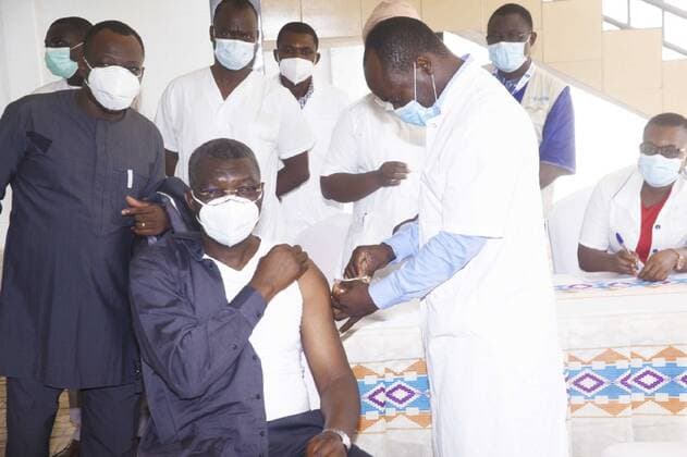(210311) -- LOME, March 11, 2021 -- Togo s Security and Civil Protection Minister Colonel Damehame Yark receives his first injection of AstraZeneca vaccine in Lome, Togo, March 10, 2021. The nationwide immunization started Thursday, which targeted health personnel and people over 50 years, in the capital Lome and its outskirts considered the hardest hit by the pandemic. (Photo by Xinhua) TOGO-LOME-COVID-19-VACCINE VictorxKelenga 