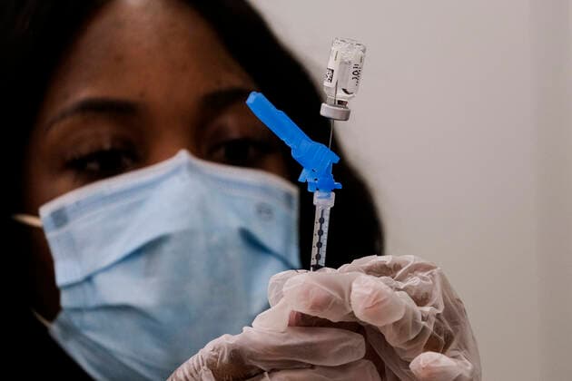 March 11, 2021, Los Angeles, California, USA: A health worker prepares a syringe with the new one-shot Johnson & Johnson COVID-19 vaccine at a vaccination event at Baldwin Hills Crenshaw Plaza. The event was hosted by the California Department of Public Health and FEMA (Federal Emergency Management Agency). The Johnson & Johnson vaccine is now the third coronavirus vaccine to receive emergency approval for use in the United States. Los Angeles USA - ZUMAc68_ 20210311_zaf_c68_001 Copyright: xRingoxChiux