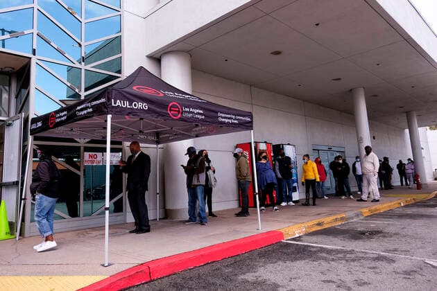 March 11, 2021, Los Angeles, California, USA: People wait in line to receive the new one-shot Johnson & Johnson COVID-19 vaccine at a vaccination event at Baldwin Hills Crenshaw Plaza in Los Angeles on March 11, 2021. The event was hosted by the California Department of Public Health and FEMA (Federal Emergency Management Agency). The Johnson & Johnson vaccine is now the third coronavirus vaccine to receive emergency approval for use in the United States. Los Angeles USA - ZUMAc68_ 20210311_zaf_c68_002 Copyright: xRingoxChiux