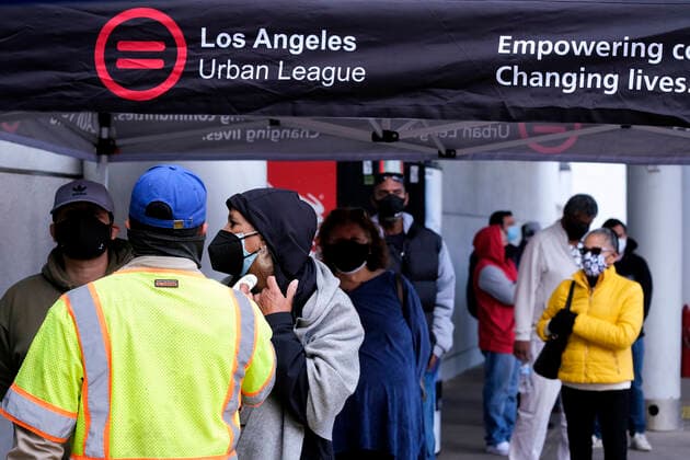 March 11, 2021, Los Angeles, California, USA: A woman gets his temperature taken before to receive the new one-shot Johnson & Johnson COVID-19 vaccine at a vaccination event at Baldwin Hills Crenshaw Plaza in Los Angeles on March 11, 2021. The event was hosted by the California Department of Public Health and FEMA (Federal Emergency Management Agency). The Johnson & Johnson vaccine is now the third coronavirus vaccine to receive emergency approval for use in the United States. Los Angeles USA - ZUMAc68_ 20210311_zaf_c68_011 Copyright: xRingoxChiux