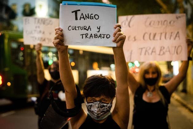 March 11, 2021, Buenos Aires, Argentina: Workers hold placards during the demonstration..Tango workers gathered at the doors of the Ministry of Culture to ask for the resumption of activity in the City of Buenos Aires and show that they have been unable to work for a year. Buenos Aires Argentina - ZUMAs197 20210311_zaa_s197_136 Copyright: xAlejoxManuelxAvilax