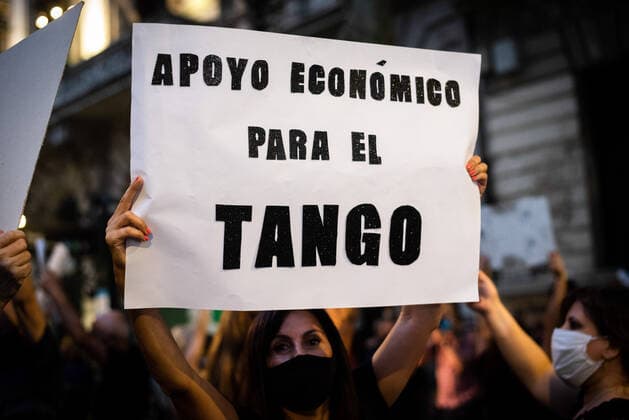 March 11, 2021, Buenos Aires, Argentina: A protester holds a placard that says Economic support for Tango during the demonstration..Tango workers gathered at the doors of the Ministry of Culture to ask for the resumption of activity in the City of Buenos Aires and show that they have been unable to work for a year. Buenos Aires Argentina - ZUMAs197 20210311_zaa_s197_137 Copyright: xAlejoxManuelxAvilax