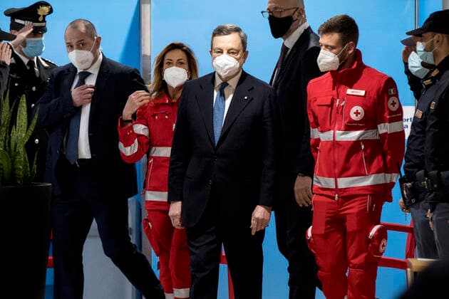 (210313) -- ROME, March 13, 2021 () -- Italian Prime Minister Mario Draghi visits the mass COVID-19 vaccination hub at Fiumicino Airport in Italy, on March 12, 2021. Speaking at a COVID-19 hub at the Fiumicino international airport in the Italian capital on Friday, Prime Minister Mario Draghi pledged to accelerate the national vaccination campaign, which has reached some 6.3 million people so far, according to government s figures. (Pool via ) ITALY-ROME-PM-COVID-19 VACCINATION HUB-VISIT Xinhua 