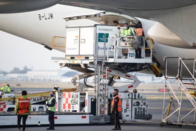 (210314) -- MEXICO CITY, March 14, 2021 -- Staff members unload a container of the COVID-19 vaccine from the Chinese pharmaceutical company Sinovac at the Mexico City s international airport in Mexico, March 13, 2021. The third shipment of the COVID-19 vaccine from the Chinese pharmaceutical company Sinovac arrived Saturday at the Mexico City s international airport. (Photo by Xinhua) MEXICO-VACCINES FROM CHINA-ARRIVAL FranciscoxCanedo 