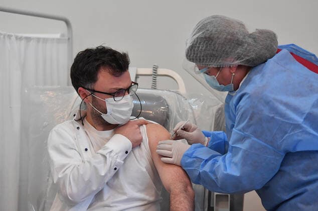 (210315) -- TBILISI, March 15, 2021 -- A man receives the COVID-19 vaccine in Tbilisi, Georgia, March 15, 2021. Georgia on March 13 received its first batch of 43,200 doses of a COVID-19 vaccine via the COVAX platform. The AstraZeneca Oxford vaccines are given to priority groups including medical workers from Monday, which marks the beginning of the nationwide vaccination campaign in Georgia, Health Minister Ekaterine Tikaradze said at a news briefing in Tbilisi. (Photo by ) GEORGIA-TBILISI-COVID-19-VACCINATION-CAMPAIGN TamunaxKulumbegashvili 