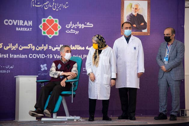 Iran: COVID-19 vaccine starts clinical trial Dr. Sina Moradmand (L) cardiologist who volunteered to receive the Barekat vaccine to begin phase 2 and 3 of its clinical trial. Tehran Tehran Iran Copyright: SobhanxFarajvan