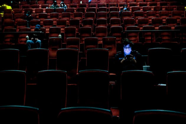 March 15, 2021, Burbank, California, USA: Moviegoers sitting in a socially distant seating arrangement at the AMC Theater on the first day of reopened theaters after being closed due to the COVID-19 pandemic. Movie theaters are able to reopen, all at limited capacity, with the county advancing today to the less-restrictive red tier. Burbank USA - ZUMAc68_ 20210315_zaf_c68_020 Copyright: xRingoxChiux