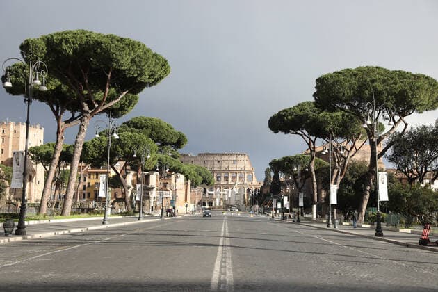 (210316) -- ROME, March 16, 2021 -- Few people walk on Via dei Fori Imperiali in Rome, Italy, March 15, 2021. Italy entered into a new period of semi-lockdown on Monday, with over half of its 20 regions falling into the red zone and subject to the maximum level of restrictions. ) ITALY-ROME-COVID-19-SEMI-LOCKDOWN ChengxTingting 