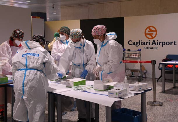(210316) -- SARDINIA, March 16, 2021 -- Medical workers prepare to conduct COVID-19 tests for passengers at the arrival area of Cagliari Airport in Sardinia island, Italy, March 15, 2021. Italy entered into a new period of semi-lockdown on Monday, with over half of its 20 regions falling into the red zone and subject to the maximum level of restrictions. The only exception is Sardinia Island, where there is no restriction on business or internal movements. (Photo by Xinhua) ITALY-SARDINIA-COVID-19-SEMI-LOCKDOWN FedericoxTardito 