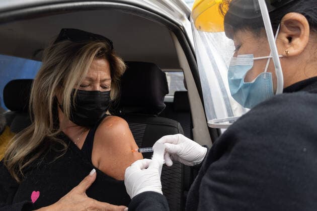 Coronavirus in Chile, Drive in Impfzentrum mit Sinovac Impfstoff in Santiago March 16, 2021, Santiago, Metropolitana, Chile: A woman is vaccinated with a dose of the Sinovac COVID-19 vaccine at a drive-thru vaccination site in Santiago, Chile. So far, almost 5 million people have been vaccinated in the country, and 41% of them with the second dose. Santiago Chile - ZUMAb332 20210316_zip_b332_007 Copyright: xMatiasxBasualdox