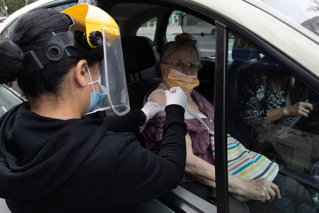 Coronavirus in Chile, Drive in Impfzentrum mit Sinovac Impfstoff in Santiago March 16, 2021, Santiago, Metropolitana, Chile: A woman is vaccinated with her second dose of the Sinovac COVID-19 vaccine at a drive-thru vaccination site in Santiago, Chile. So far, almost 5 million people have been vaccinated in the country, and 41% of them with the second dose. Santiago Chile - ZUMAb332 20210316_zip_b332_014 Copyright: xMatiasxBasualdox