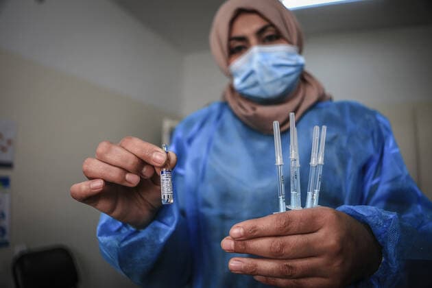 March 17, 2021, Gaza City, The Gaza Strip, Palestine: A shot of the Sputnik V Covid-19 vaccine is prepared to be administered at the Ministry of Health Sabha Al Harazeen clinic, in Al Shejaeiya neighborhood, in the east of Gaza City, 17 March 2021. The Palestinian Authority received on 17 March around 60,000 coronavirus vaccine doses as a first shipment through the COVAX initiative. People start to receive doses of Russia s Sputnik V COVID-19 coronavirus vaccine in the Ministry of Health clinics and United Nations Relief and Works Agency for Palestine Refugees (UNRWA) s clinics. Gaza City Palestine - ZUMAq100 20210317_zaa_q100_004 Copyright: xAbedxAlrahmanxAlkahloutx