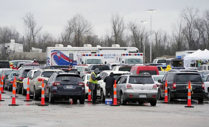 Hundreds wait in their cars to get in line for Covid-19 vaccination shots at the Family Arena during a mass vaccination drive-in event in St. Charles, Missouri on Thursday, March 18, 2021. The event attracted 4,000 people, some waiting over four hours in their cars for their first shot to protect them from the coronavirus.  SLP2021031810 BILLxGREENBLATT