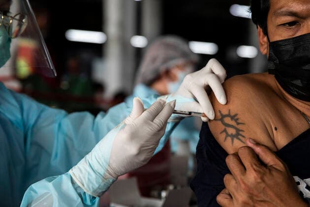 March 19, 2021, Thailand: A health worker administers a dose of CoronaVac, a Covid-19 coronavirus vaccine developed by Chinaâ€⠢s Sinovac Biotech ltd, in Bangkok, Thailand, on Friday March 19, 2021. Health workers have been vaccinating 600 residents per day, after a cluster of Covid-19 coronavirus cases were discovered at the Bang Khae market in Bangkok on Wednesday, March 17. Thailand - ZUMAm249 20210319_zip_m249_004 Copyright: xAndrexMalerbax