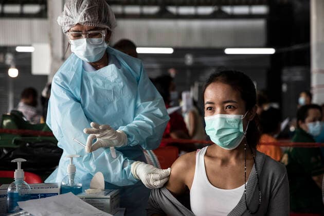 March 19, 2021, Thailand: A health worker administers a dose of CoronaVac, a Covid-19 coronavirus vaccine developed by Chinaâ€⠢s Sinovac Biotech ltd, in Bangkok, Thailand, on Friday March 19, 2021. Health workers have been vaccinating 600 residents per day, after a cluster of Covid-19 coronavirus cases were discovered at the Bang Khae market in Bangkok on Wednesday, March 17. Thailand - ZUMAm249 20210319_zip_m249_006 Copyright: xAndrexMalerbax