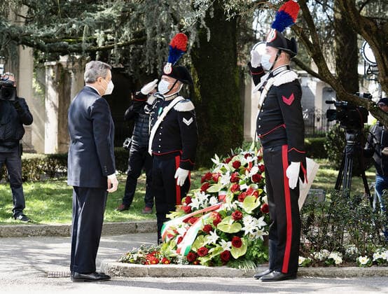 (210319) -- BERGAMO, March 19, 2021 -- Italian Prime Minister Mario Draghi lays a flower wreath during an activity to mark the first National Day of Remembrance for COVID-19 victims in Bergamo, Italy, March 18, 2021. Italy on Thursday marked the first National Day of Remembrance for COVID-19 victims. According to the Health Ministry s data updated to Wednesday, Italy s death toll reached 103,432. Overall, it counts more than 3.2 million coronavirus cases, which included the deaths, plus over 2.6 million recoveries, and over 539,000 active infections. TO GO WITH Feature: Italy marks 1st National Day for COVID-19 victims () ITALY-COVID-19-NATIONAL DAY OF REMEMBRANCE-VICTIMS PoolxviaxXinhua 