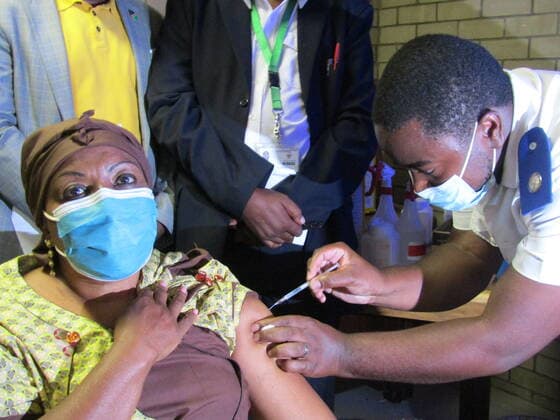 (210319) -- WINDHOEK, March 19, 2021 -- Namibia s Deputy Minister of Health Esther Utjiua Muinjangue (L) receives a jab of the COVID-19 vaccine at Windhoek Central Hospital in Windhoek, capital of Namibia, March 19, 2021. (Photo by Xinhua) NAMIBIA-WINDHOEK-COVID-19-VACCINATION MusaxCxKaseke 