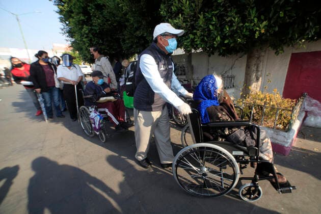 Begins Apply Of Dose Of Sputnik V In Mexico NEZAHUALCOYOTL CITY, MEXICO - MARCH 19: People wait their turn in line to be able to receive a pass and be able to access the vaccination module, where health workers apply the Sputnik V vaccine, during the mass vaccination of the national vaccination program for adults over 60 years old against Covid-19 disease, at Nezahualcoyotl Sports Unit located in municipality of Nezahualcoyotl, State of Mexico. On March 19, 2021 in Nezahualcoyotl City, Mexico. Copyright: xAngelxMoralesxRizox EYEPIXGROUP_AM_19032021_5016