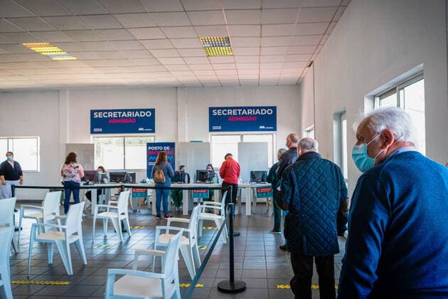 March 20, 2021, Matosinhos, Portugal: Elderly people wearing facemasks stand in line waiting to be registered at the vaccination center before being vaccinated..In the Vaccination Center of Matosinhos 1000 elderly people were summoned to receive the second dose of the Moderna covid-19 vaccine. Matosinhos Portugal - ZUMAs197 20210320_zaa_s197_337 Copyright: xTeresaxNunesx