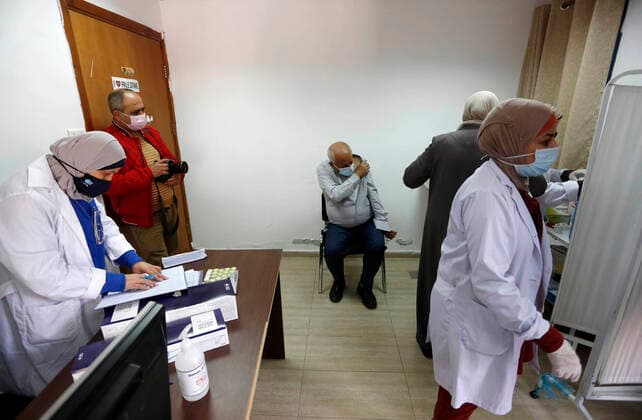 March 21, 2021, Nablus, West Bank, Palestinian Territory: Palestinians receive the dose of the coronavirus disease (COVID-19) vaccine during a campaign to vaccinate front-line for those aged over 75, cancer patients and medical personnel, at the health ministry in the West Bank city of Nablus, on March 21, 2021 Nablus Palestinian Territory - ZUMAap3_ 20210321_zaf_ap3_031 Copyright: xShadixJarar Ahx