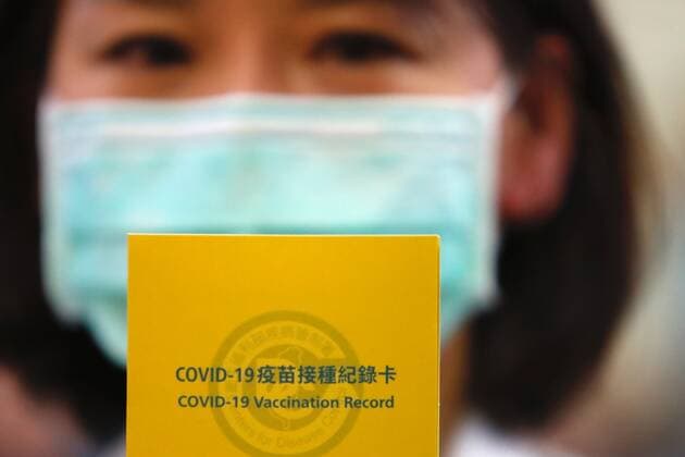 March 22, 2021, Taipei, Taipei, Taiwan: A nurse holds a Covid vaccination record card after she received AstraZeneca inoculation against Covid-19, as Taiwan begins vaccinations, at Far Eastern Hospital in Taipei. Medical workers including doctors and nurses, predominant officials and those aged 65 or above will be inoculated first across Taiwan whilst the Taiwanese vaccines remain clinical trials. Taipei Taiwan - ZUMAs313 20210322_zip_s313_013 Copyright: xDanielxCengxShou-Yix